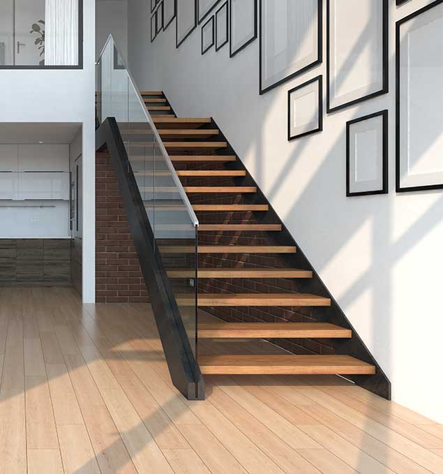 Modern wooden staircase with glass railing in contemporary home.