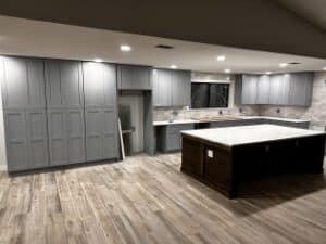 Modern kitchen remodeling with gray cabinetry and island for contemporary home upgrades.