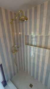 Bathroom remodeling with elegant shower and tile upgrade for modern home renovation.
