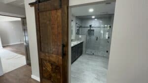 Stylish bathroom remodel featuring a spacious walk-in shower and contemporary vanity.