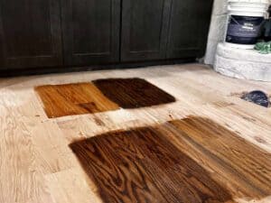High-quality hardwood flooring installation with a mix of natural and dark wood planks.