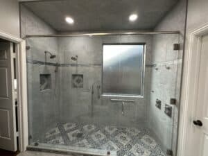 Luxury shower renovation with custom tile design and safety features.