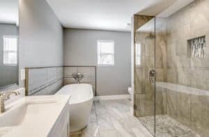 Modern bathroom with walk-in shower, soaking tub, and sleek fixtures for stylish home updates.