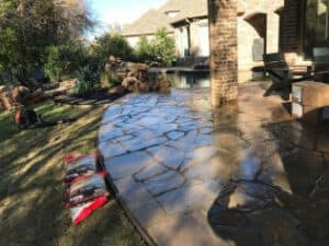 Beautiful stamped concrete patio installation by Salvation Home Remodeling. Enhance your outdoor space today.