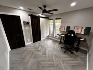 Modern home office with stylish decor and natural light, perfect for renovation projects.