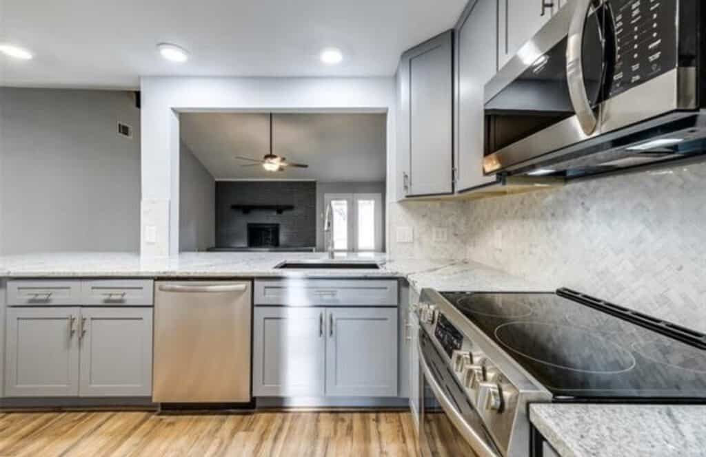 Modern kitchen renovation with updated appliances and cabinetry.