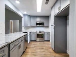 Modern kitchen with updated cabinets and appliances for stylish home renovation.