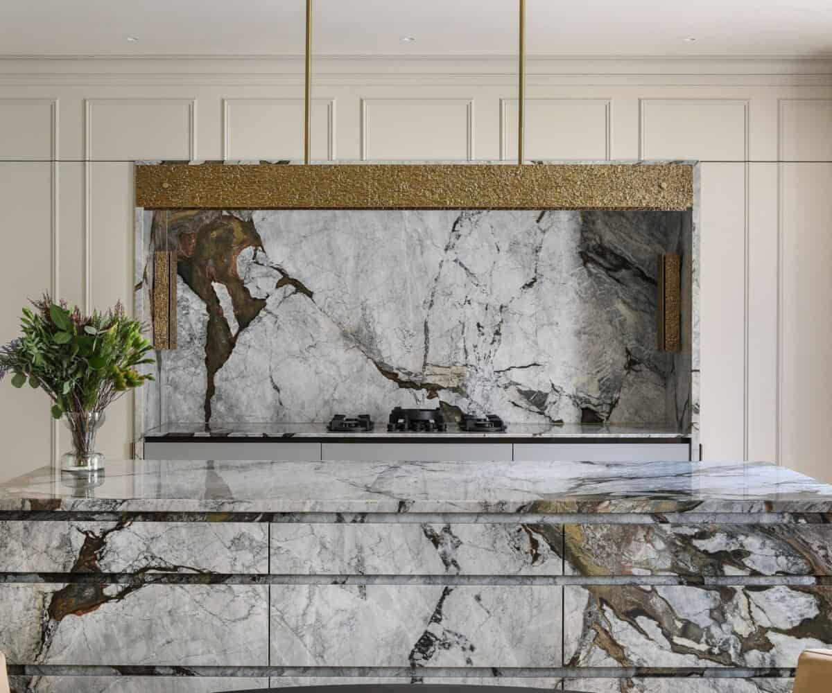 High-end marble kitchen backsplash and countertop for elegant home renovation.