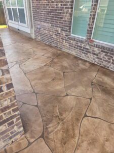 Durable stamped concrete patio with decorative patterns perfect for backyard remodeling.