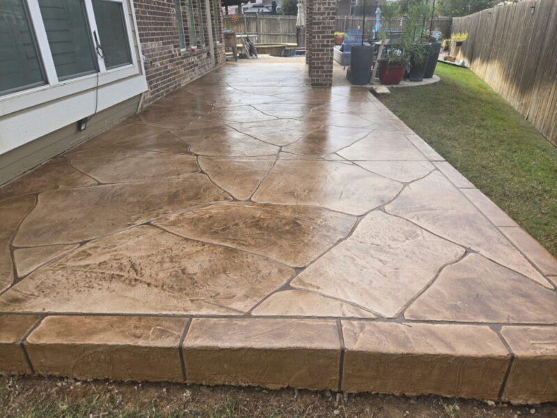 Durable stamped concrete patio adds aesthetic appeal to home exteriors.