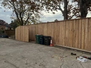 New wooden privacy fence installed by Salvation Home Remodeling in a residential yard.