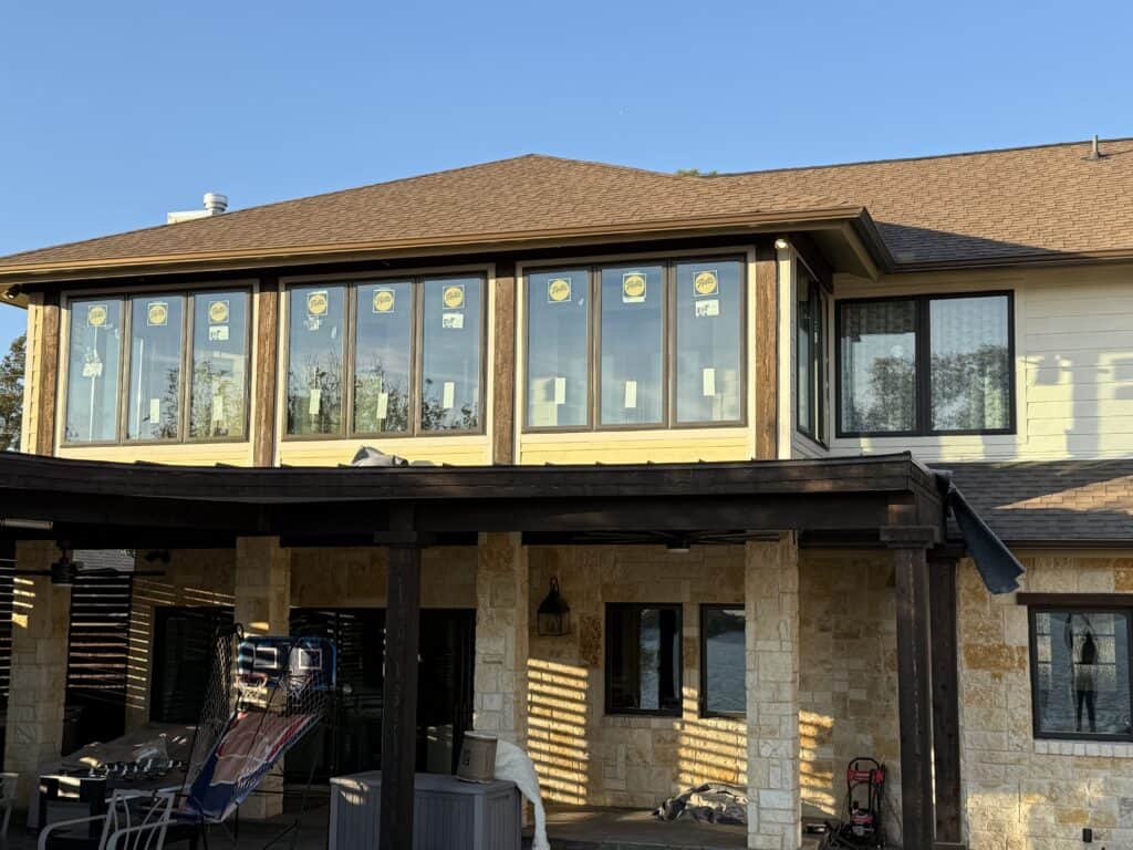 Bright, stylish house with new window installation and outdoor living space.
