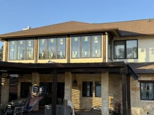 Bright, stylish house with new window installation and outdoor living space.