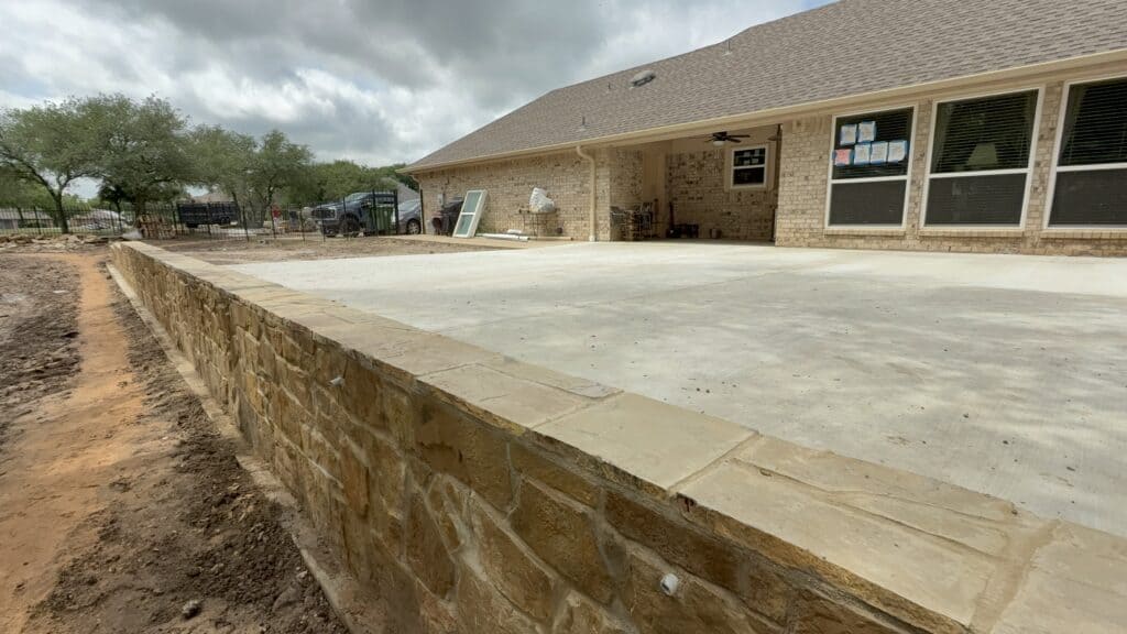 Expanded patio with stone border adds value and curb appeal.