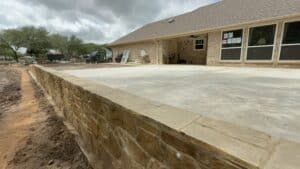 Expanded patio with stone border adds value and curb appeal.