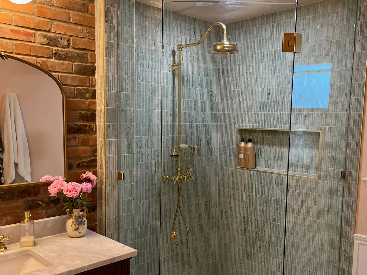 Small bathroom remodel with mosaic tile walk-in shower and marble-top vanity by Salvation Home Remodeling