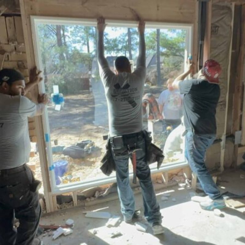 High-quality window installation in progress during home remodeling by Salvation Home Remodeling for enhanced natural light.
